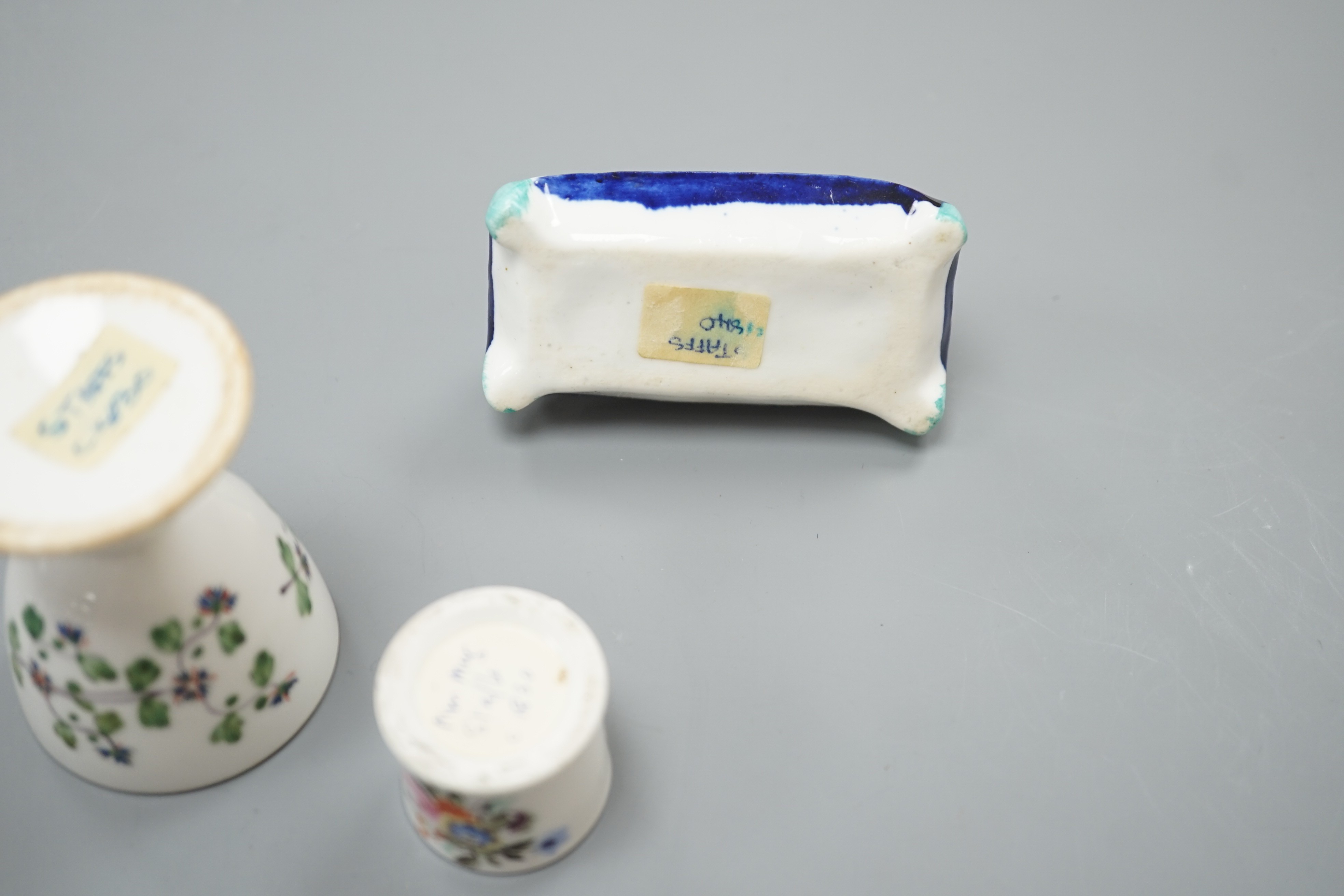 A mid 19th century Staffordshire porcelain Dalmatian pen holder and a cornflower spray egg cup and a miniature mug, tallest 6cm